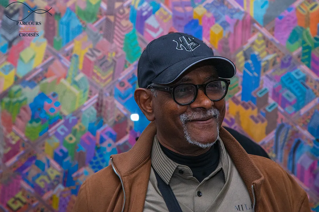 A guest framed by a colourful abstract painting