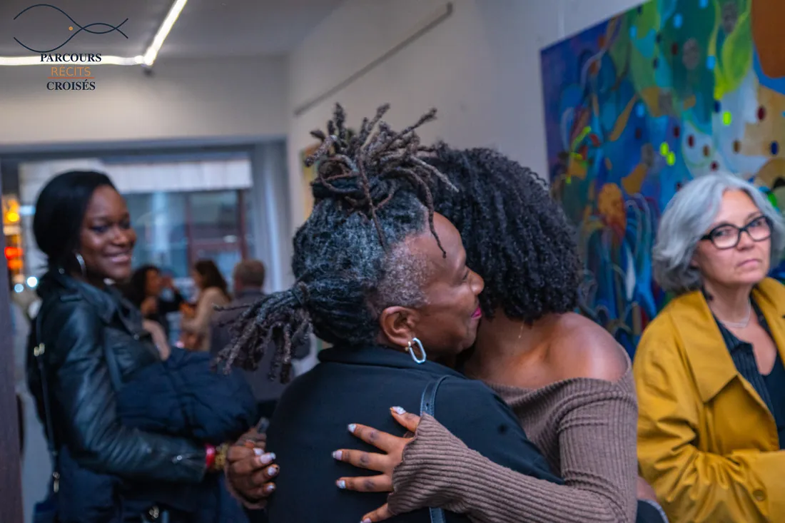 Friends greeting each other at the opening