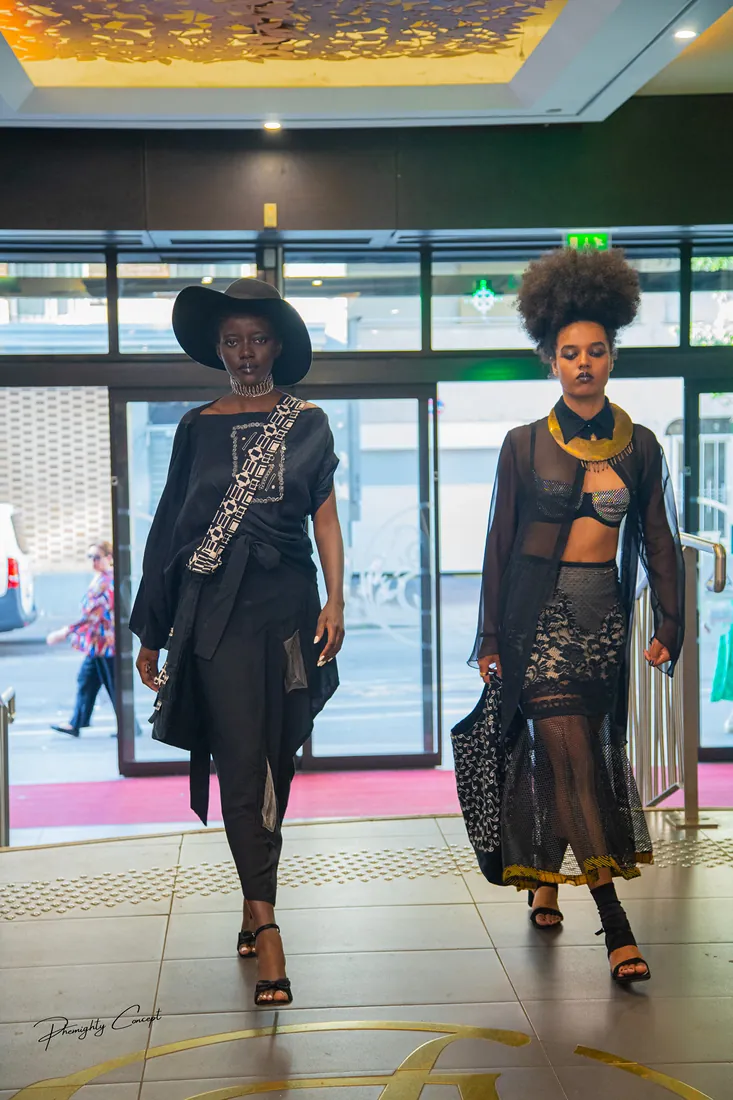 Two models walking through the shopping centre