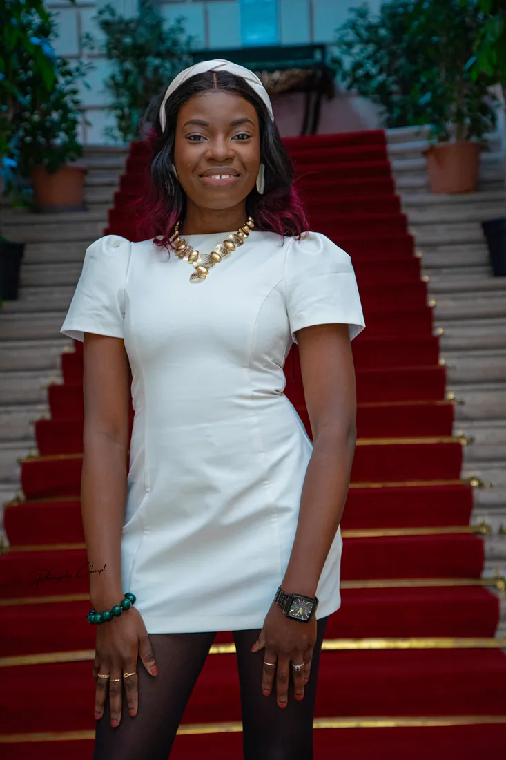 The bride on the red-carpeted staircase of the town hall