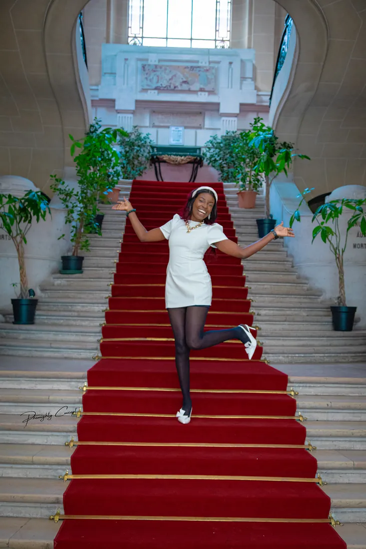 A playful kick on the red staircase