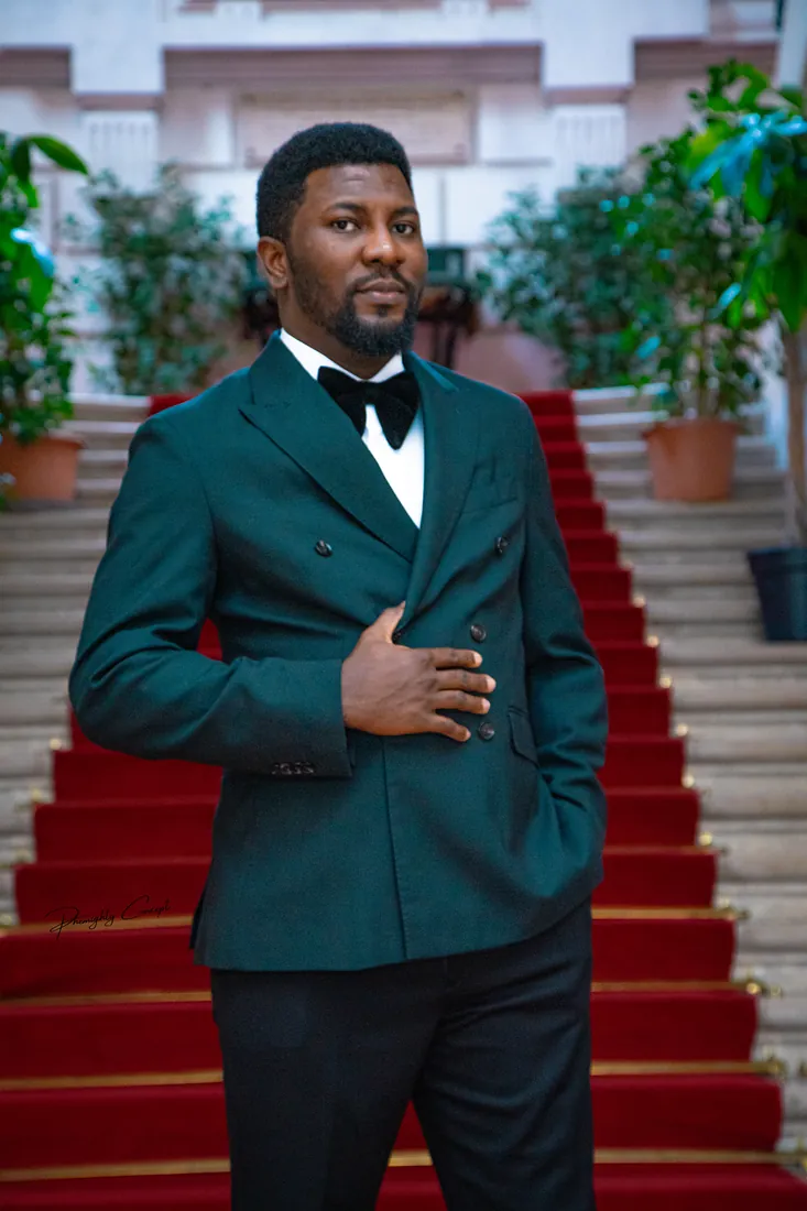 The groom in a green double-breasted suit